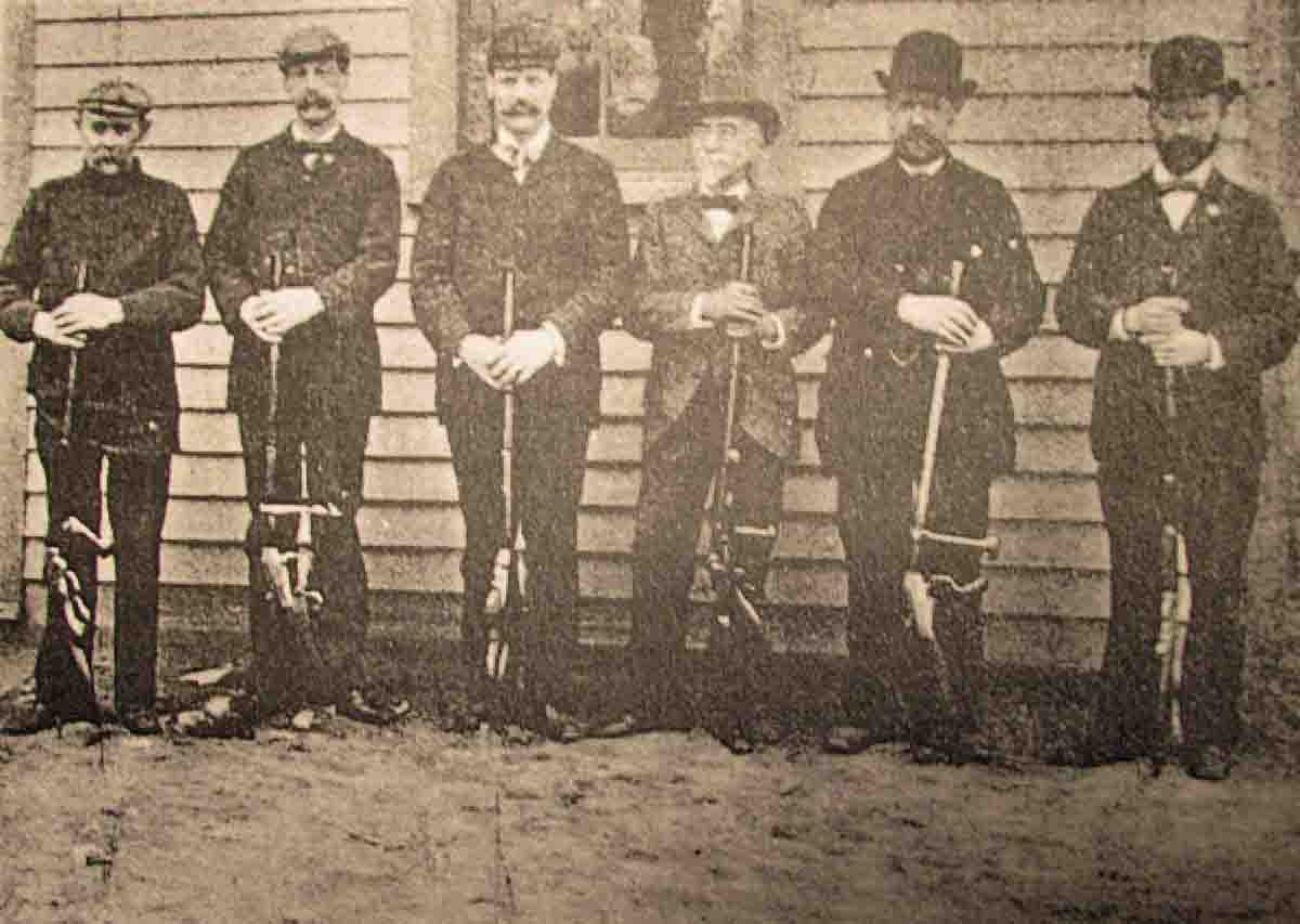 Dorrler, left, poses next to Wm. Hayes and other good company about 1900.